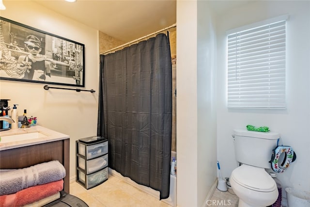 bathroom featuring vanity, tile patterned floors, and toilet