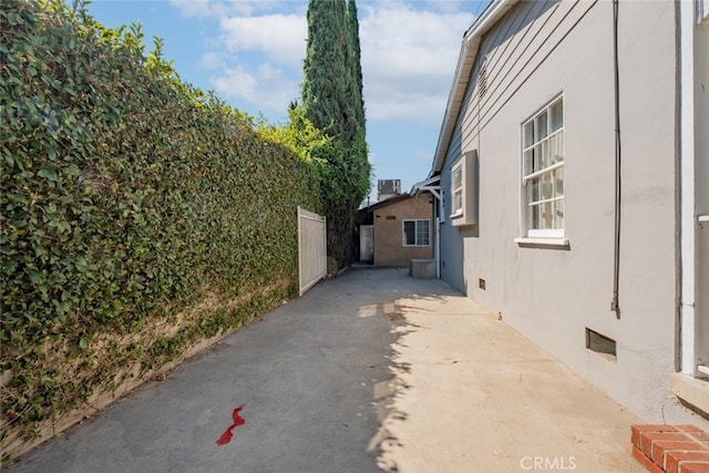 view of side of property featuring a patio area