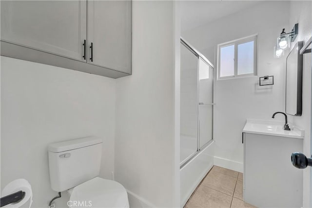 full bathroom featuring toilet, tile patterned floors, vanity, and shower / bath combination with glass door