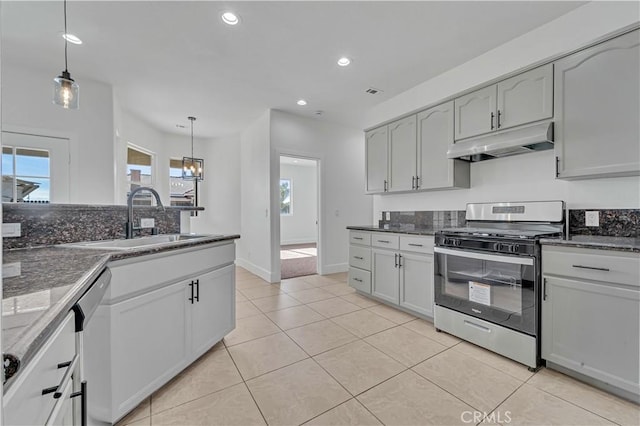 kitchen featuring sink, dishwasher, stainless steel gas stove, white cabinetry, and decorative light fixtures