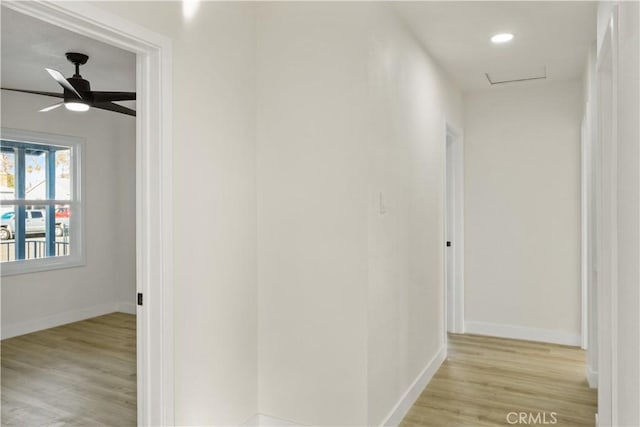 hallway with light hardwood / wood-style flooring