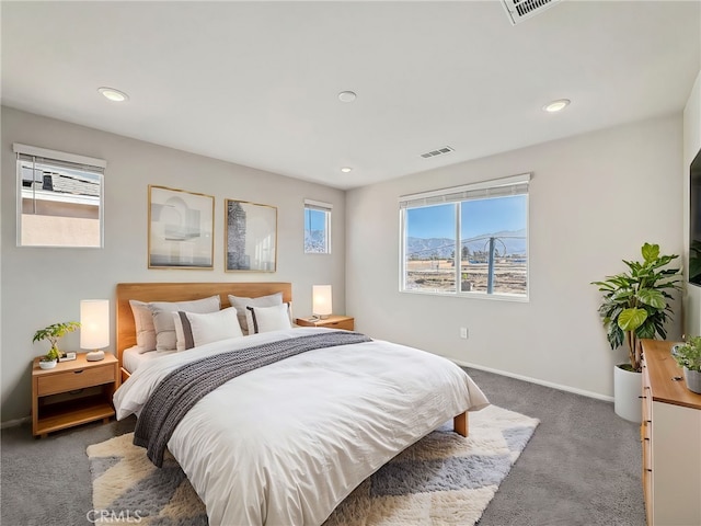 carpeted bedroom with recessed lighting, visible vents, and baseboards