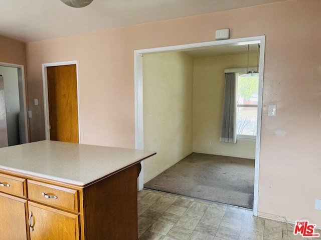 kitchen with light carpet