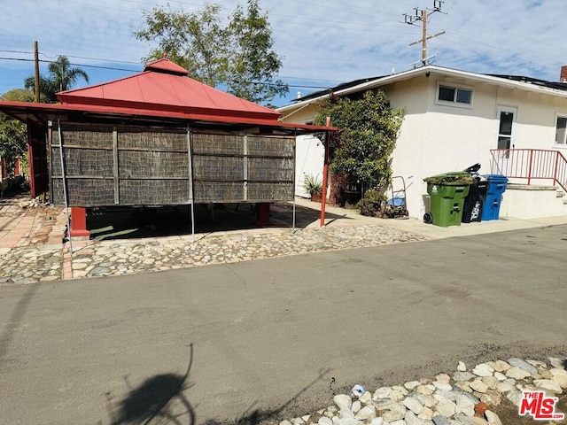 view of property exterior with an outbuilding