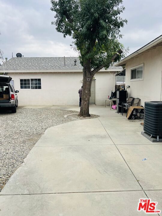 exterior space with a patio and central AC