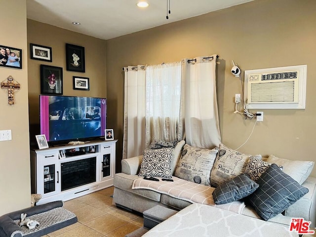 living room featuring a wall mounted air conditioner and light tile patterned flooring