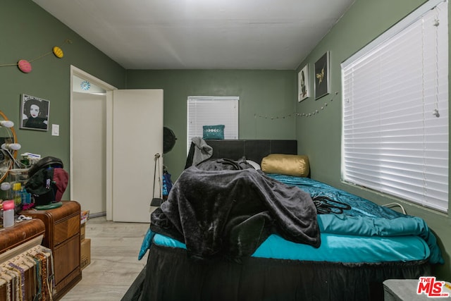 bedroom featuring light wood-type flooring