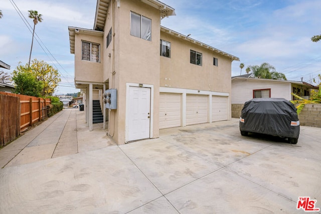 back of house with a garage