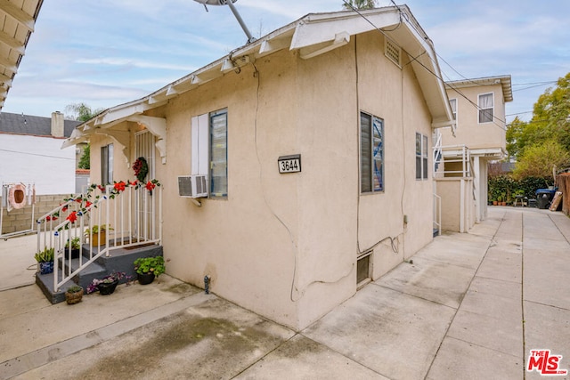 view of side of home featuring a patio area