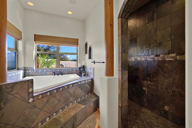 full bathroom featuring a bath, a walk in shower, and recessed lighting