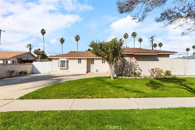 ranch-style home with a front lawn