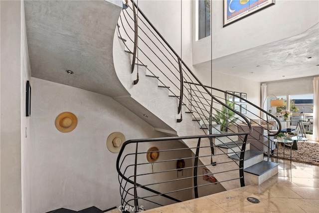 stairs with a towering ceiling