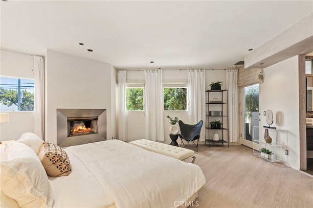 bedroom with light hardwood / wood-style floors