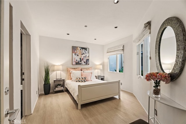 bedroom with light hardwood / wood-style floors