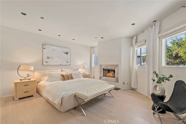 bedroom with light hardwood / wood-style flooring