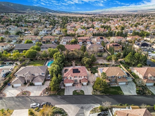 drone / aerial view with a residential view and a mountain view