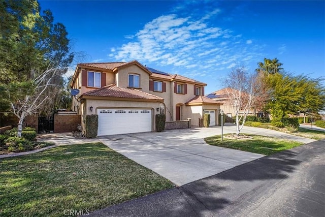 view of front of property with a garage, a tile roof, concrete driveway, and stucco siding