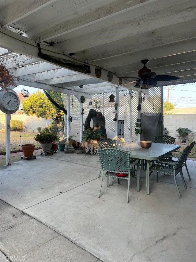 view of patio / terrace with outdoor dining area and a ceiling fan