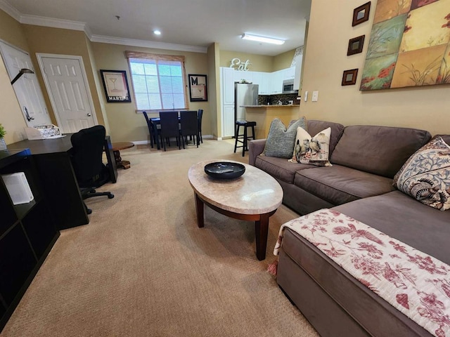 carpeted living room featuring ornamental molding