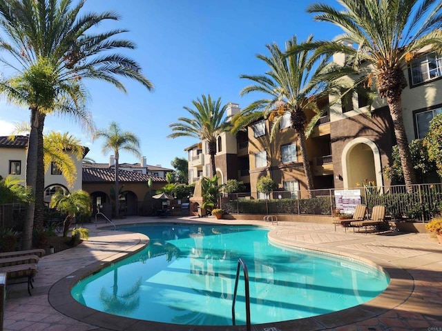 view of swimming pool with a patio area