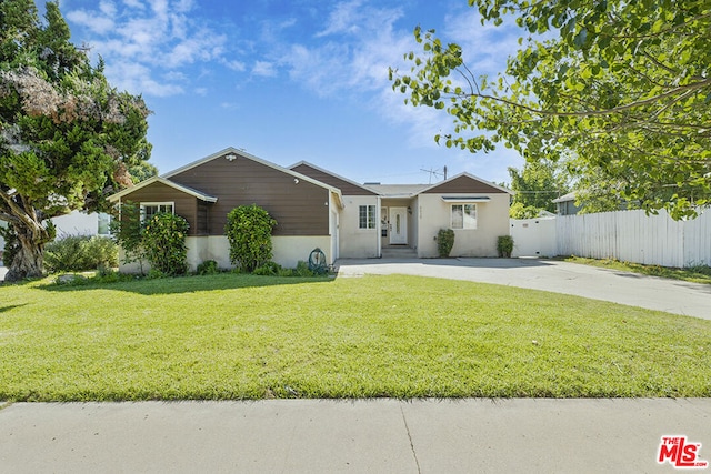 ranch-style house with a front lawn