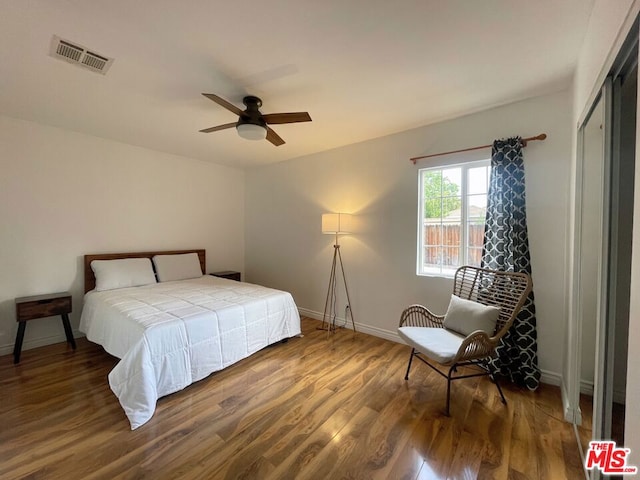 bedroom featuring dark hardwood / wood-style floors and ceiling fan