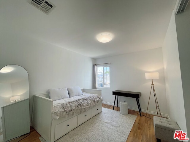 bedroom featuring hardwood / wood-style floors