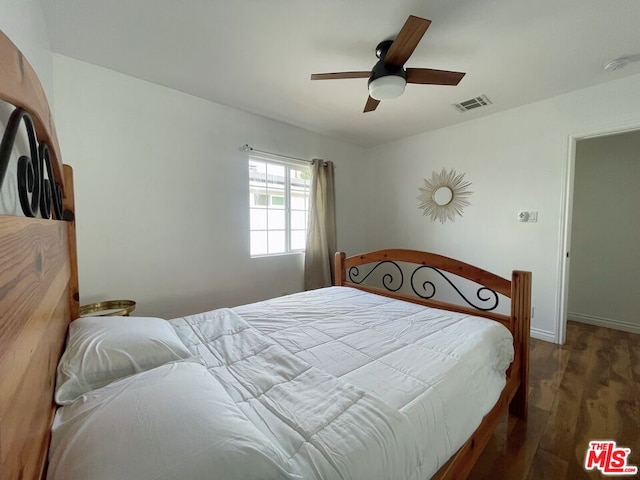 bedroom featuring dark hardwood / wood-style floors and ceiling fan