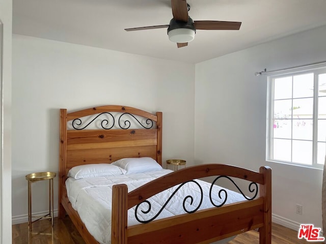 bedroom featuring hardwood / wood-style floors and ceiling fan