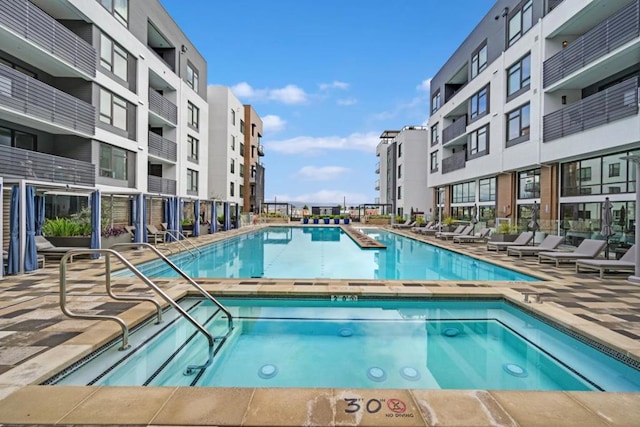 view of pool with a community hot tub