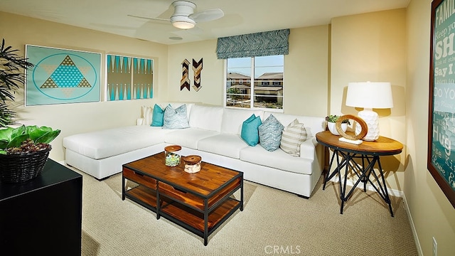 carpeted living room featuring ceiling fan