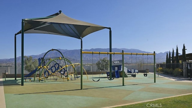 view of playground with a mountain view