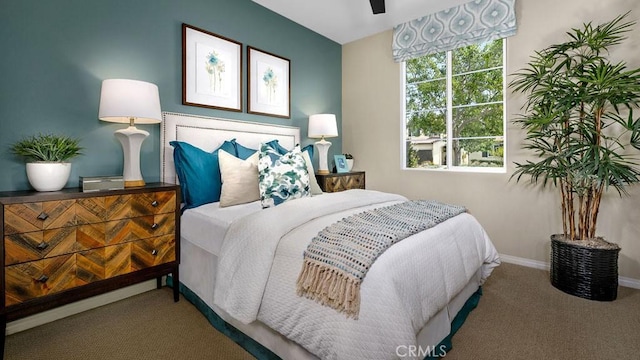 carpeted bedroom featuring ceiling fan