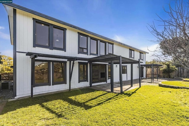 back of house featuring a yard, a pergola, a patio area, and central AC unit