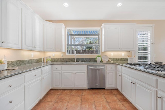 kitchen with sink, stainless steel appliances, and white cabinets