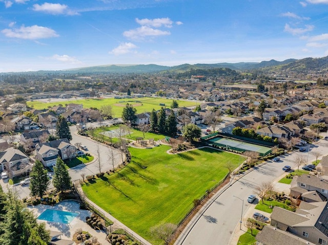 birds eye view of property featuring a mountain view