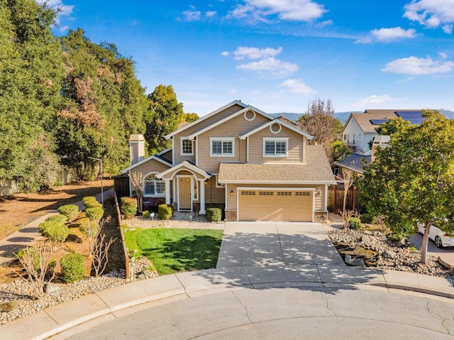 view of front of property with a garage and a front yard