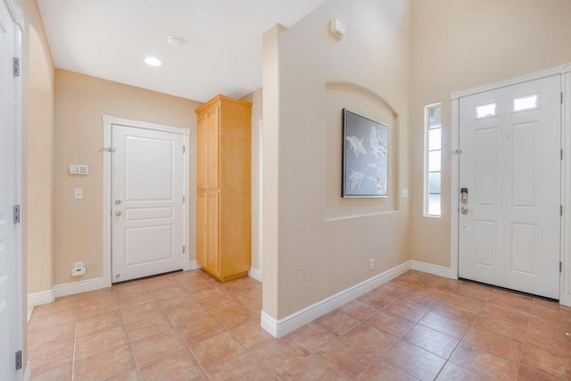 foyer featuring light tile patterned flooring