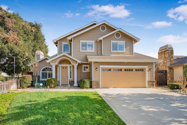 view of front facade with a garage and a front yard