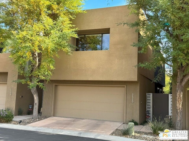 southwest-style home with a garage