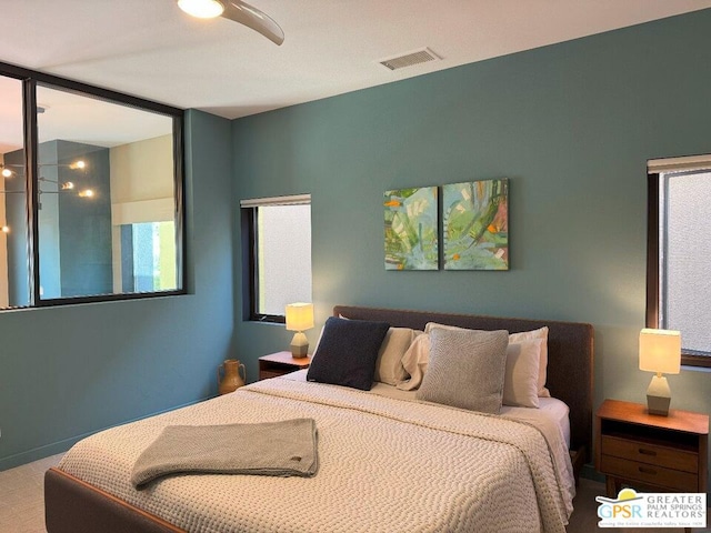 bedroom with ceiling fan and carpet flooring