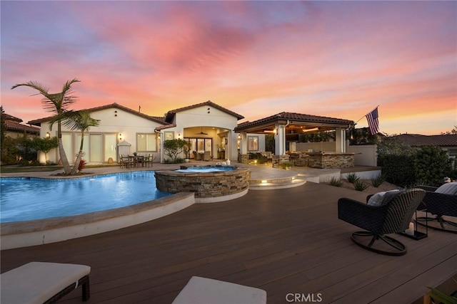 view of pool at dusk