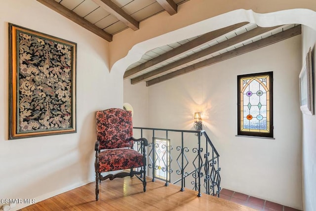 sitting room with lofted ceiling with beams, hardwood / wood-style floors, and wood ceiling