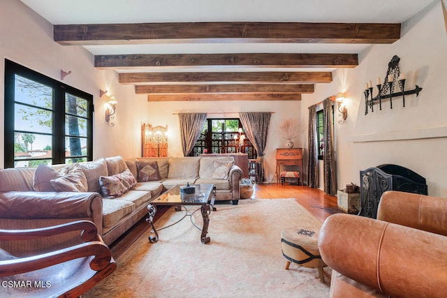 living room with hardwood / wood-style flooring and beam ceiling