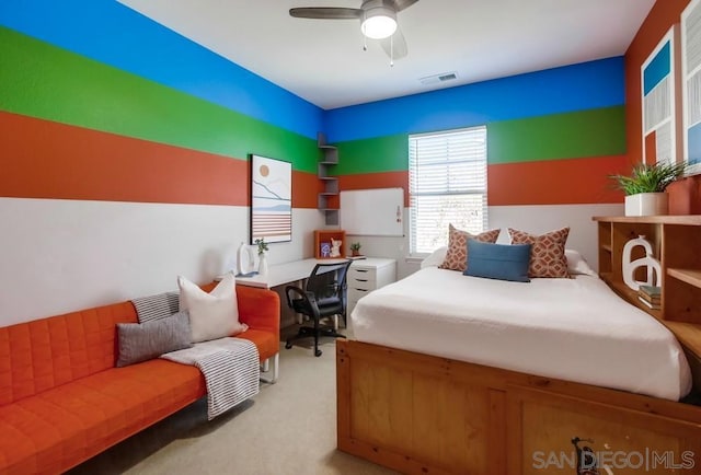 carpeted bedroom featuring ceiling fan