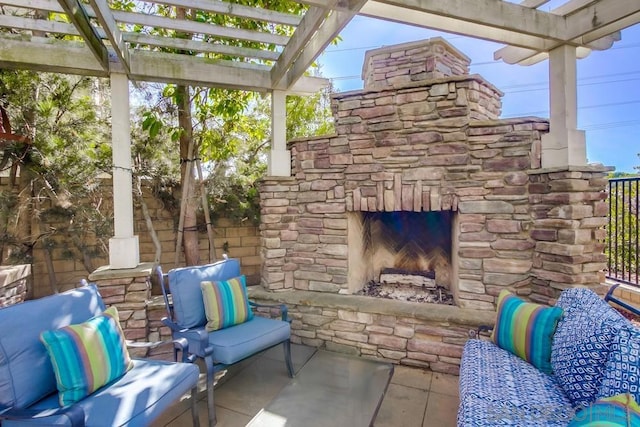 view of patio / terrace featuring a pergola and an outdoor living space with a fireplace