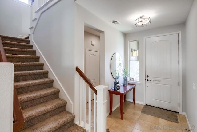 entrance foyer with light tile patterned floors