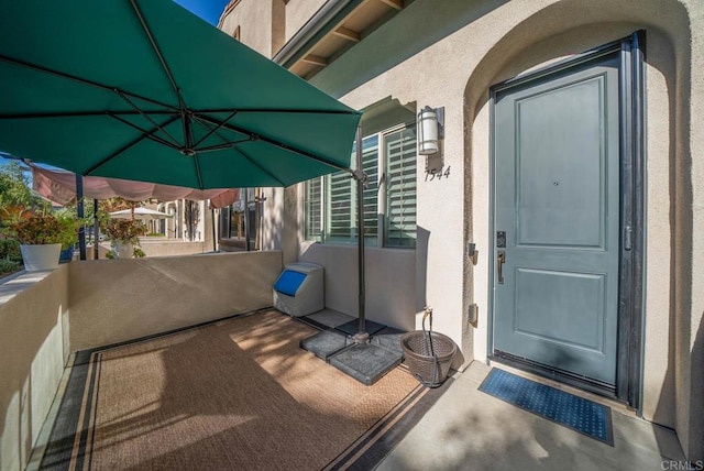 doorway to property featuring a balcony