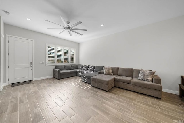 living room featuring ceiling fan