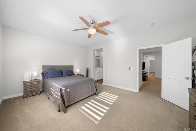 carpeted bedroom featuring ensuite bathroom and ceiling fan